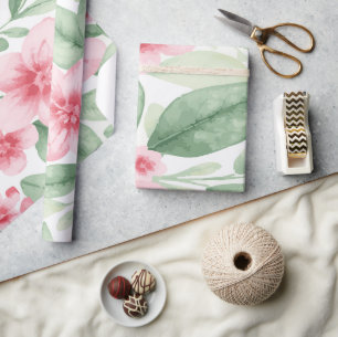 Zarte rosa Blüten mit grünen Blättern auf Weiß Geschenkpapier