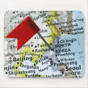 Zeichnen Sie das Button auf, das auf Nordkorea auf Mousepad