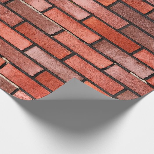 Ziegelmauer mit rotem Backstein, roter Backstein. Geschenkpapier (Ecke)