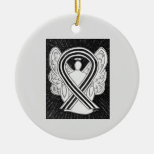 Zierdekorationen aus dem Angel mit weißem und schw Keramikornament