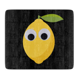 Zitronenfigur, süße Frucht mit googgen Augen Schneidebrett