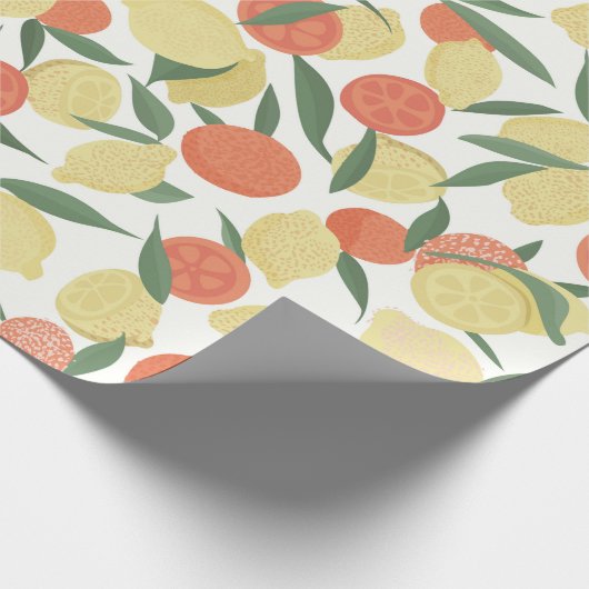 Zitronenfrüchte und Orangenfrüchte mit Blätter auf Geschenkpapier (Ecke)