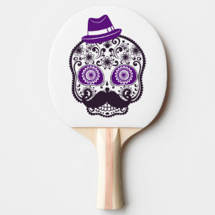 Zuckerschädel mit kleinen lila Hut und dem Tischtennis Schläger