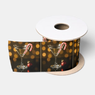 Zuckerstange in einem Weihnachts-Martini Satinband