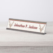 Zwei braune, verehrte Köpfe verkünden weiße rote G Schreibtischnamensplakette (Vorderseite )