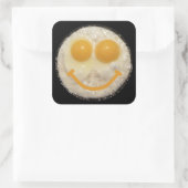Zwei Eier im Bratpfanne mit Lächeln Quadratischer Aufkleber (Tasche)
