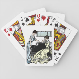 Zwei Frauen in langen Kleider spielen Karten Spielkarten