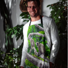 Zwei grüne Affen, die in der Schürze Baumdruck sit