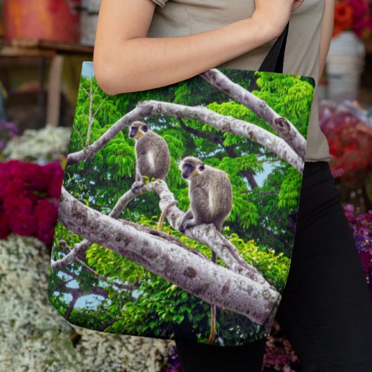 Zwei grüne Affen sitzen im Baumkronenbeutel Tasche