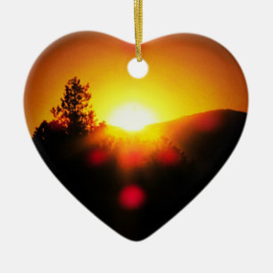 Zwei helle orangefarbene Sonnenuntergänge Keramikornament