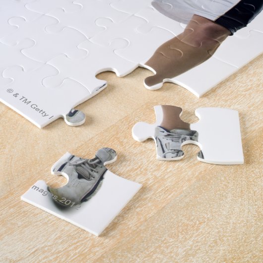 Zwei junge Männer spielen Lacrosse Puzzle (Seite)