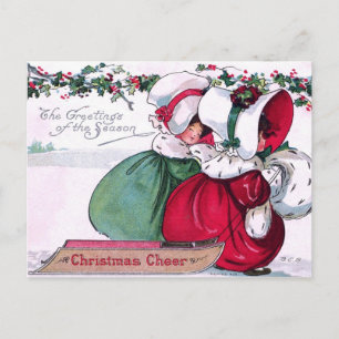 Zwei kleine Mädchen ziehen einen Weihnachtsschlitt Feiertagspostkarte