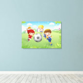 Zwei Mädchen und ein Junge spielen Fußball Leinwanddruck (Insitu (Holzboden))