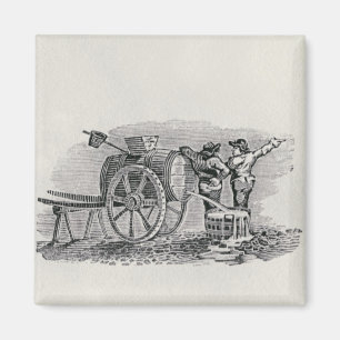 Zwei Männer mit Barrel Cart Magnet