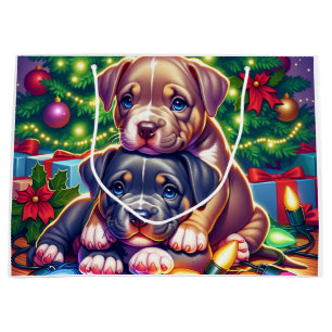 Zwei Niedliche Welpen spielen unter dem Weihnachts Große Geschenktüte