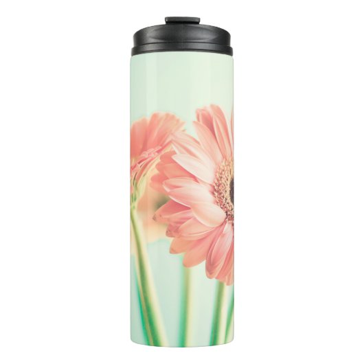 Zwei palepinfarbene Blume Thermosbecher (Vorderseite)