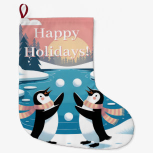Zwei Pinguine jonglieren Schneebälle bei einem Win Großer Weihnachtsstrumpf