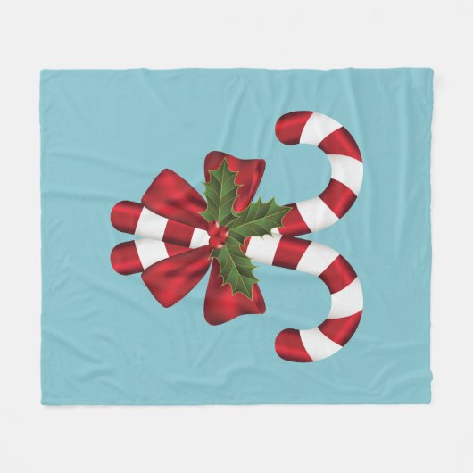 Zwei rote und weiße, festliche Süßigkeiten auf bla Fleecedecke (Vorderseite (Horizontal))