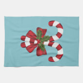 Zwei rote und weiße, festliche Süßigkeiten auf bla Geschirrtuch (Horizontal)