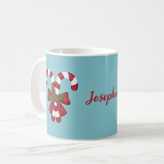 Zwei rote und weiße Süßigkeiten auf blau mit Namen Kaffeetasse (Vorderseite Links)