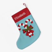 Zwei rote und weiße Süßigkeiten auf blau mit Namen Kleiner Weihnachtsstrumpf (Rückseite (Hängend))