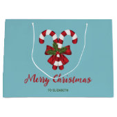 Zwei rote und weiße Süßigkeiten auf blau mit Text Große Geschenktüte (Vorderseite)