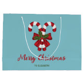 Zwei rote und weiße Süßigkeiten auf blau mit Text Große Geschenktüte (Rückseite)