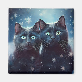 Zwei schwarze Katzen werden angeschneit Magnet