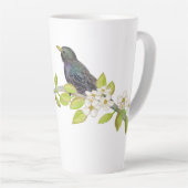 Zwei Starlings auf einem blühenden Zweig im Frühja Milchtasse (Rechte Ecke)