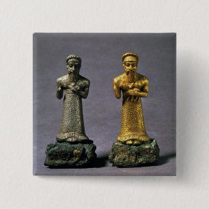 Zwei Statuetten der Männer, die Angebote der Button