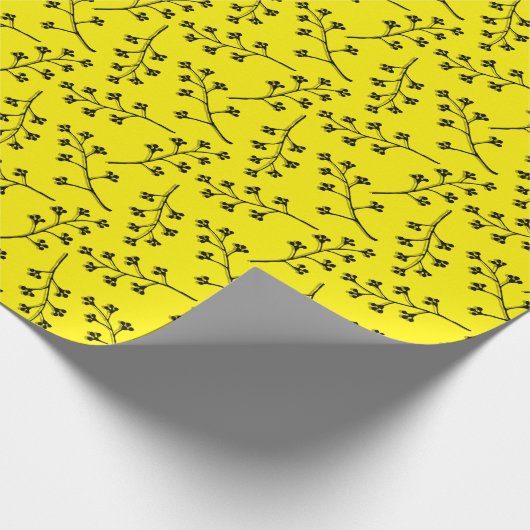 Zweig aus schwarzer Pflanze auf Gelb Geschenkpapier (Ecke)