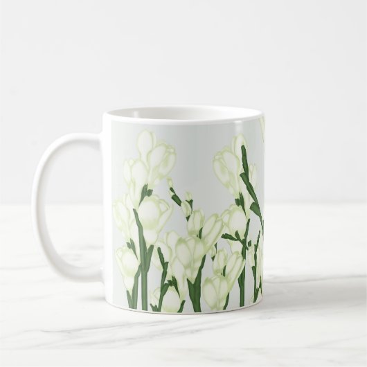 Zweig von weißem Freesia. Kaffeetasse (Links)