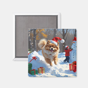 Zwergspitz läuft im Schnee mit Weihnachtsmütze Magnet